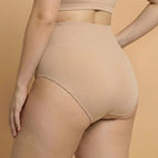 Beige shapewear against a beige background